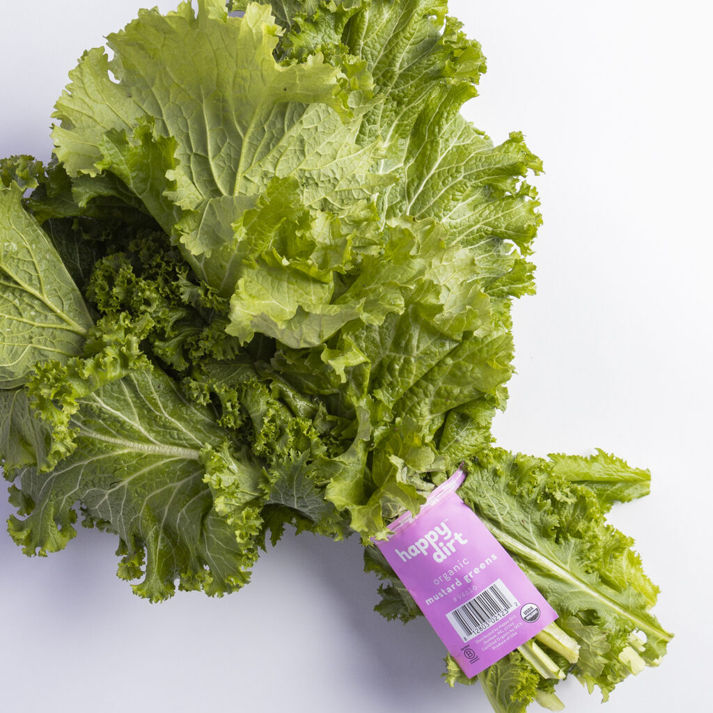 bunched organic mustard greens with happy dirt skirt tag